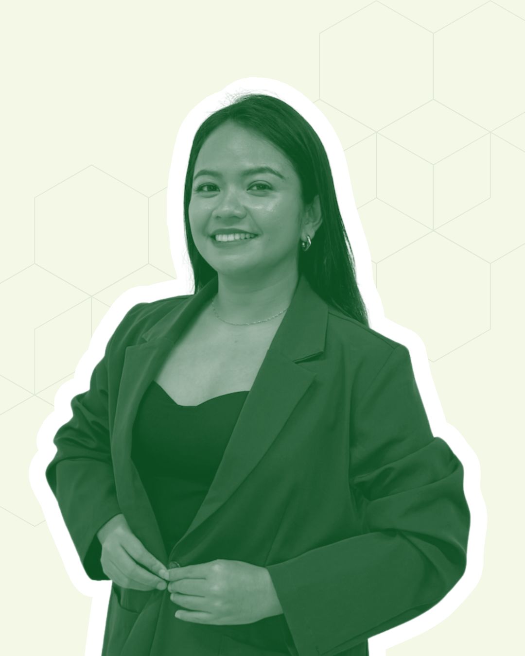 Woman in green blazer posing confidently.